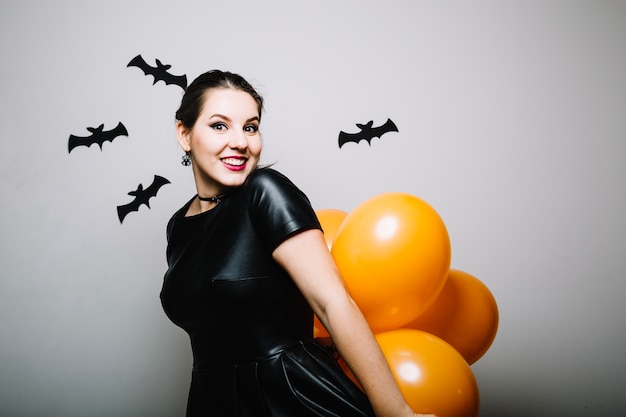 Free photo smiling woman in paper bats