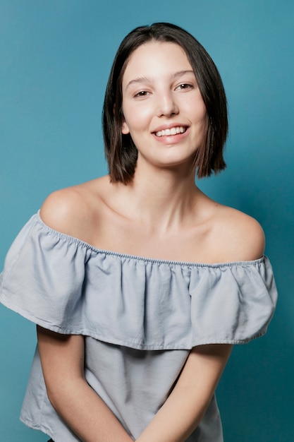 Smiling woman posing in ruffle top