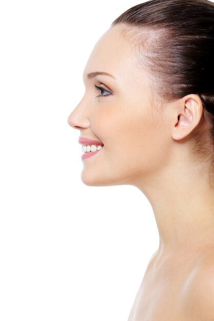 smiling woman's face with clean pure skin