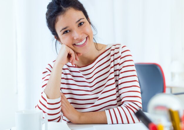 Smiling woman sitting at desk