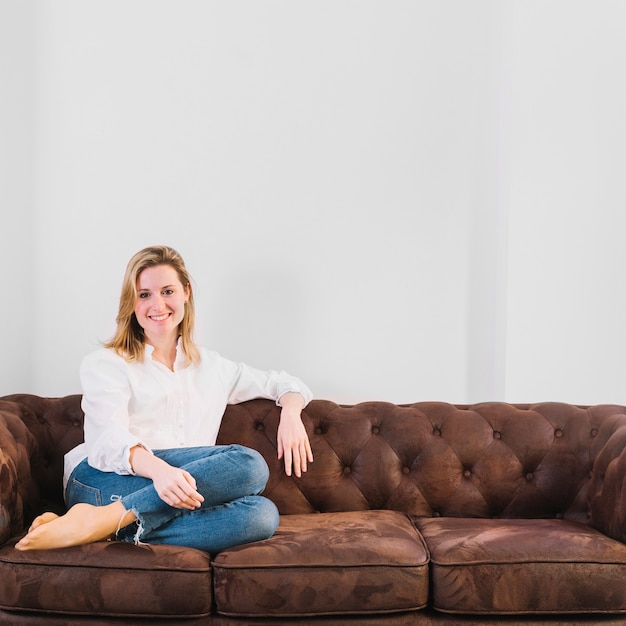 Smiling woman on sofa