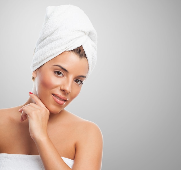 Smiling woman in towel after spa