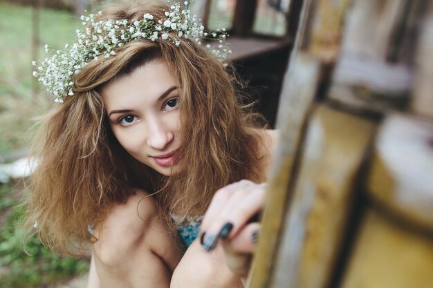 Smiling woman wearing a wreath