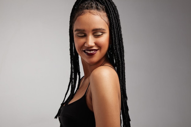 Smiling woman with african braids