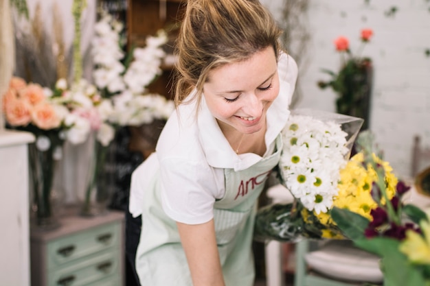 Smiling woman with bouquets