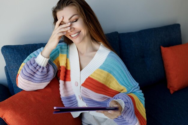 smiling woman with closed eyes at home