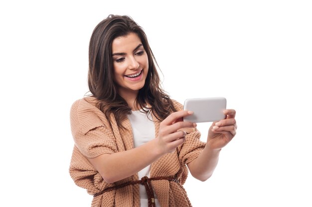 Smiling woman with contemporary mobile phone