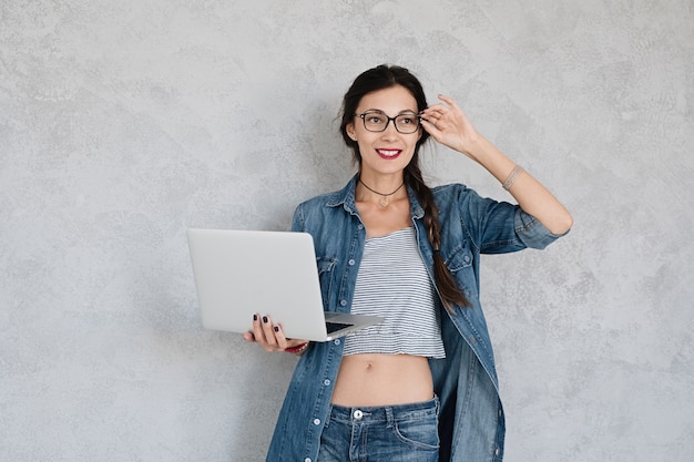 Smiling woman with laptop