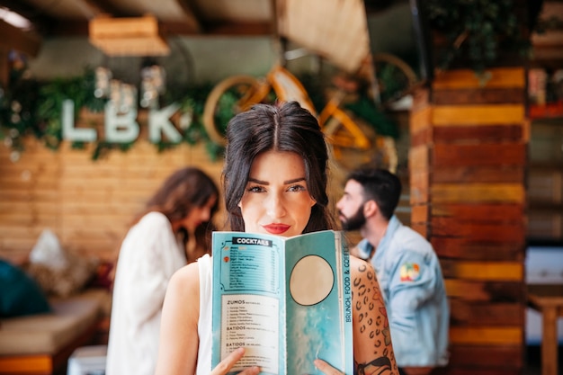 Smiling woman with menu