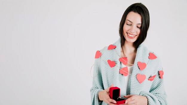 Smiling woman with ring in box