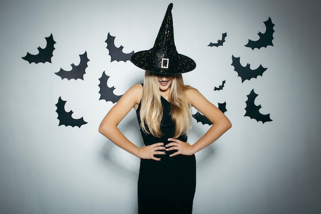 Free photo smiling woman with witch hat