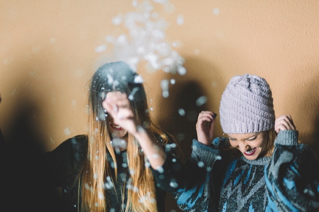 Smiling women under snow
