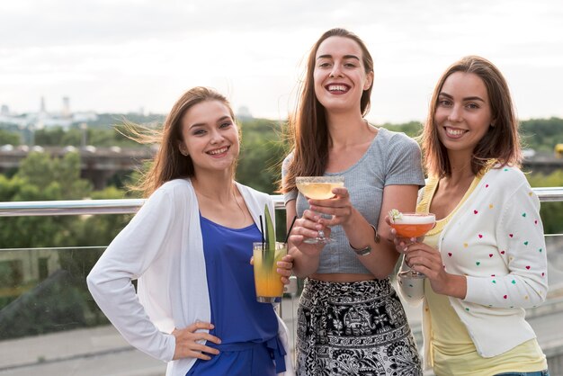 Smiling women at a terrace party