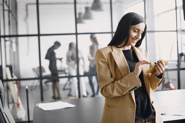 Smiling young African American businesswoman working in an office. Business concept.