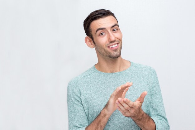 Smiling Young Attractive Man Clapping Hands