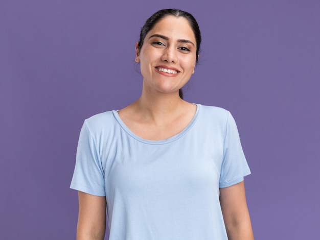 Smiling young brunette caucasian girl looking at camera