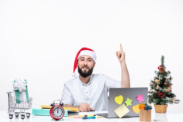 Smiling young businessman in office celebrating christmas working