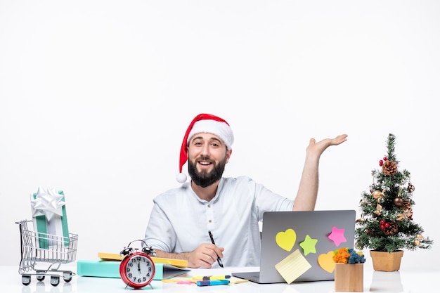 Smiling young businessman in office celebrating christmas working