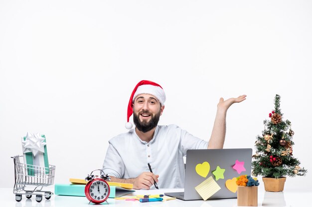 Smiling young businessman in office celebrating christmas working