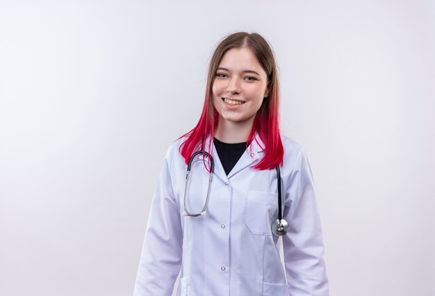 Smiling young doctor girl wearing stethoscope medical robe on isolated white background