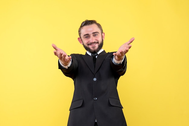 Free photo smiling young man welcoming his business partners