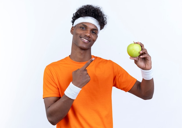 Smiling young sporty man wearing headband