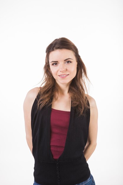 Smiling young woman against white background