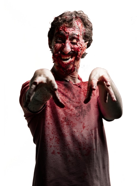 Free photo smiling zombie with arms raised