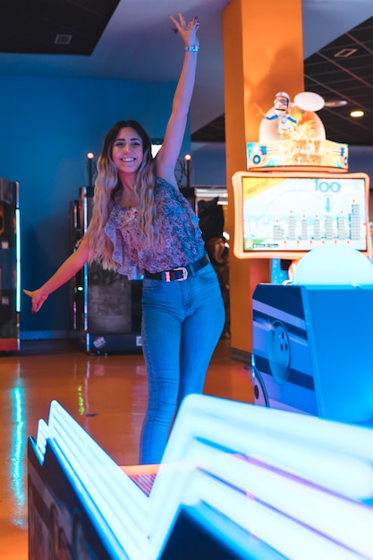 Smilling girl posing with neon lights