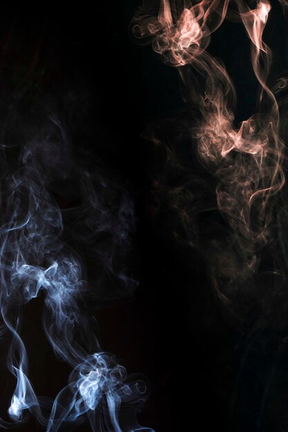 Smoke blowing abstract on the corner of the dark background