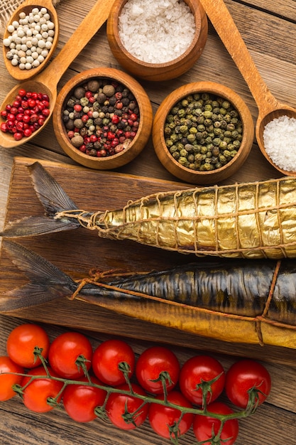 Free photo smoked fishes and spices  flat lay