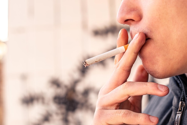 Free Photo smoking concept man smoking a cigarette harmful to health