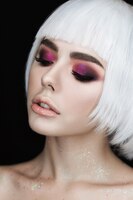 smoky eyes make-up beautiful young blonde woman with volume hairstyle. 