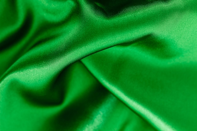 滑らかでエレガントな緑の布素材の質感