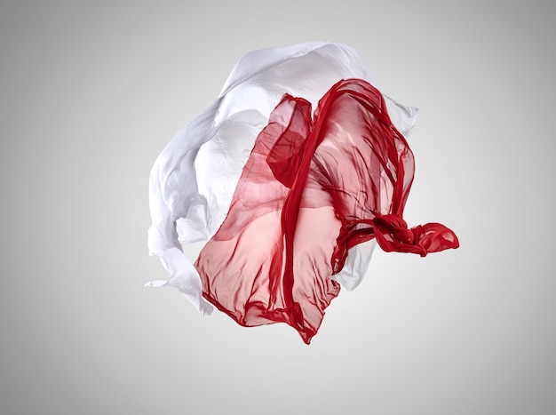 Smooth elegant transparent red and white cloth separated on gray