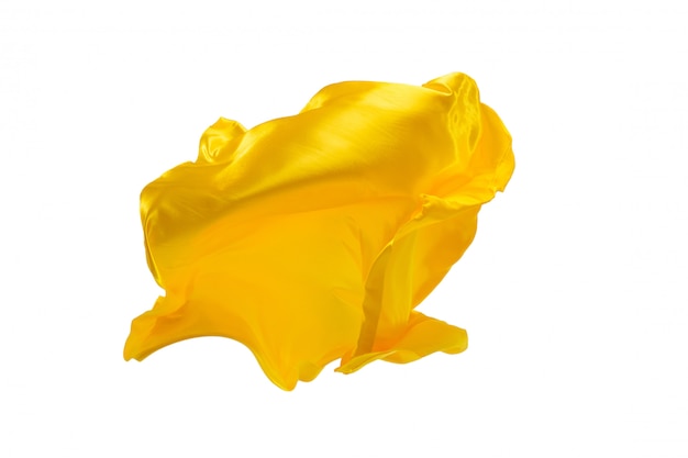 Smooth elegant transparent yellow cloth separated on white.