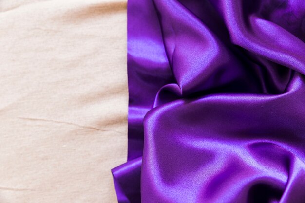 Smooth purple fabric on plain textile