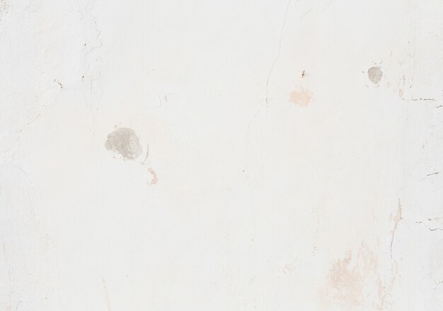 Smooth stained white plaster surface