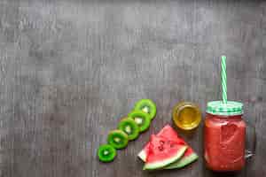 Free photo smoothie of watermelon and kiwi on wooden background