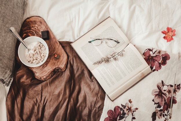 Snack and book on bed