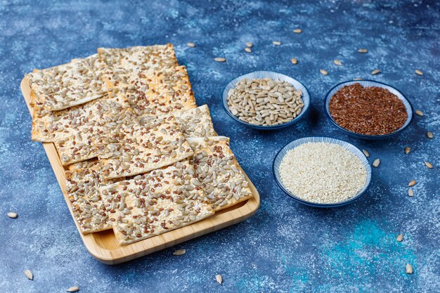 Snack cookies with sunflower seed,linen seed,sesame seeds on grey table