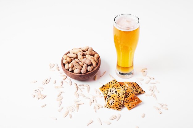 Snacks and beer on white.