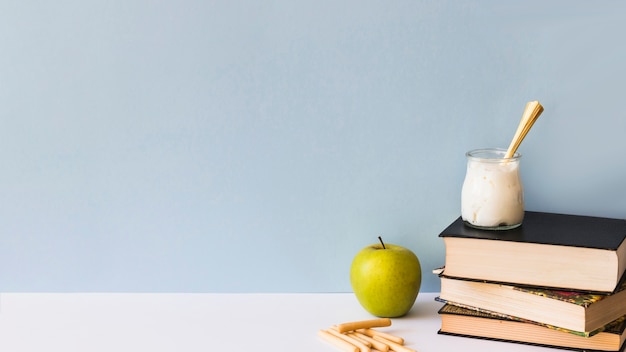 Snacks near stack of books