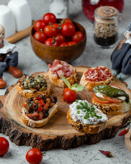 Snacks set on wooden board  