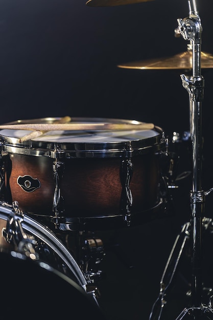 Snare drum on a blurred dark background part of a drum kit