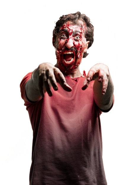 Free photo snarling zombie with arms raised