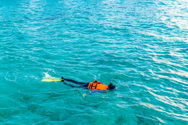 Snorkeling in tropical Maldives island .