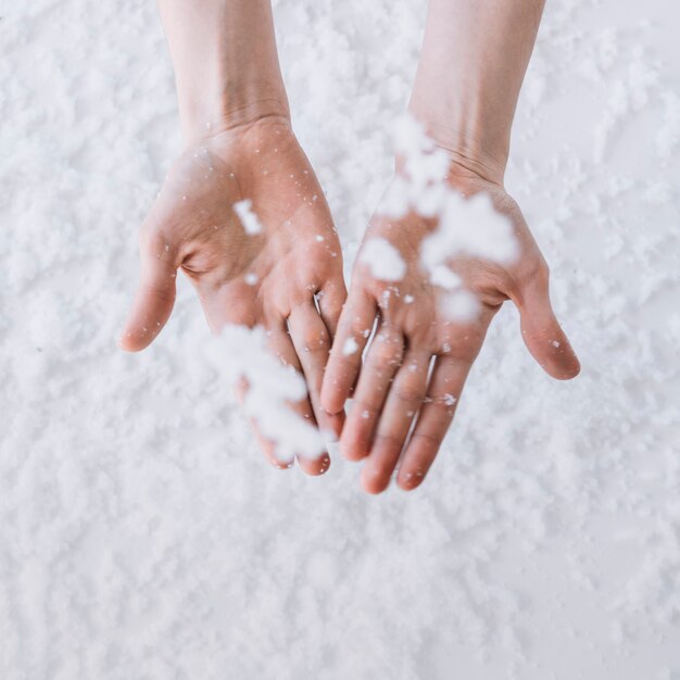 Snow falling on hands 