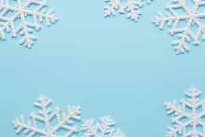 Free photo snowflakes on blue surface