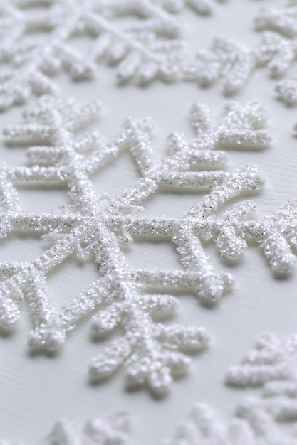 Snowflakes on white surface